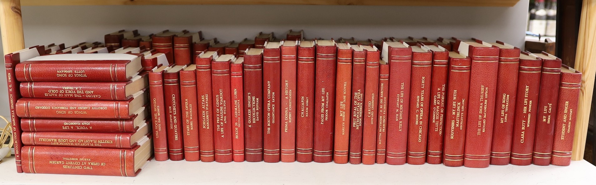 A collection of 19th and 20th century works on opera related biographies, autobiographies and histories, bound in red morocco by EA Weeks, London, approx 66 altogether